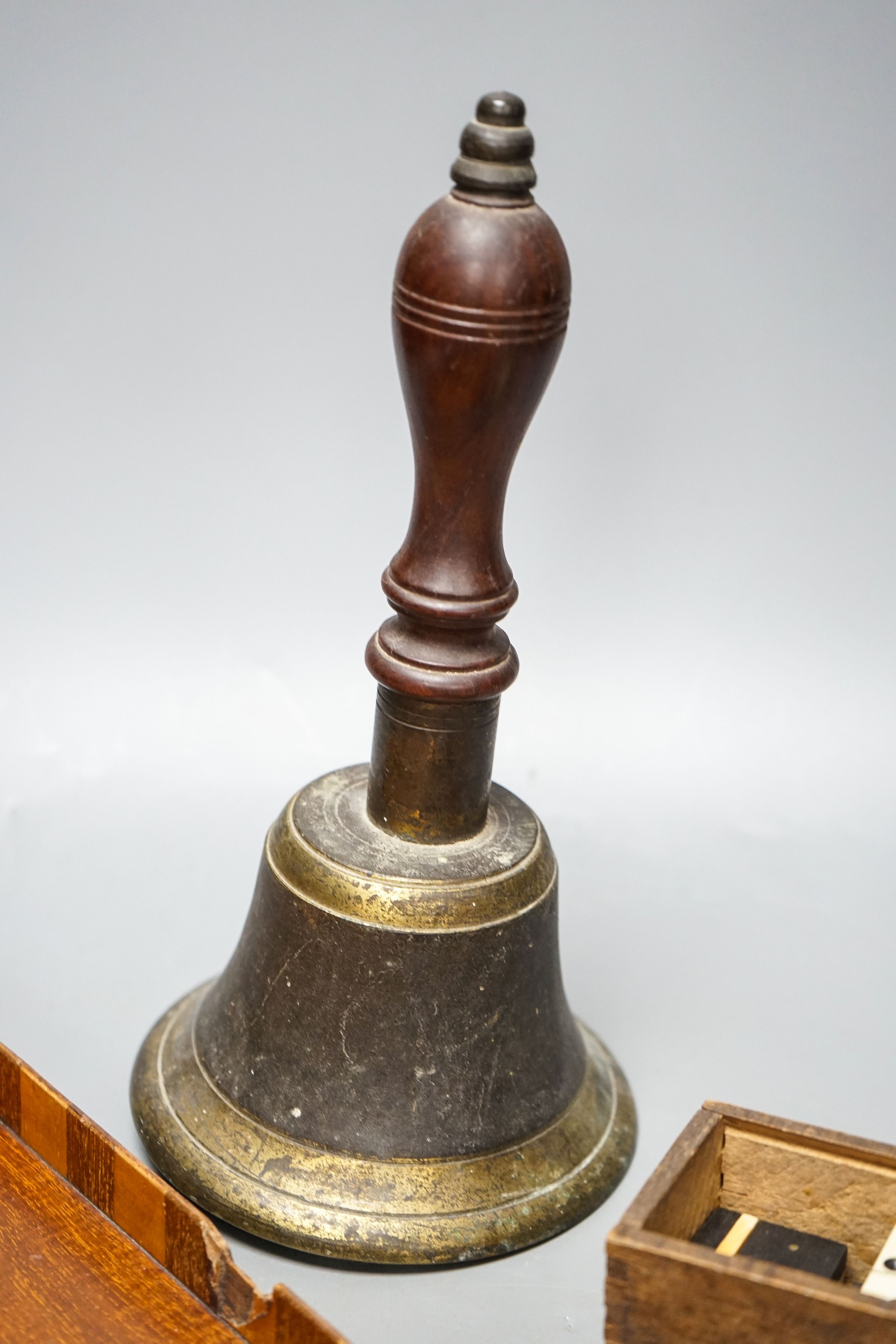 A Victorian bronze school bell, a tray and sundry items